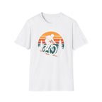 White t-shirt with a graphic of a mountain biker and sunset design on a white background